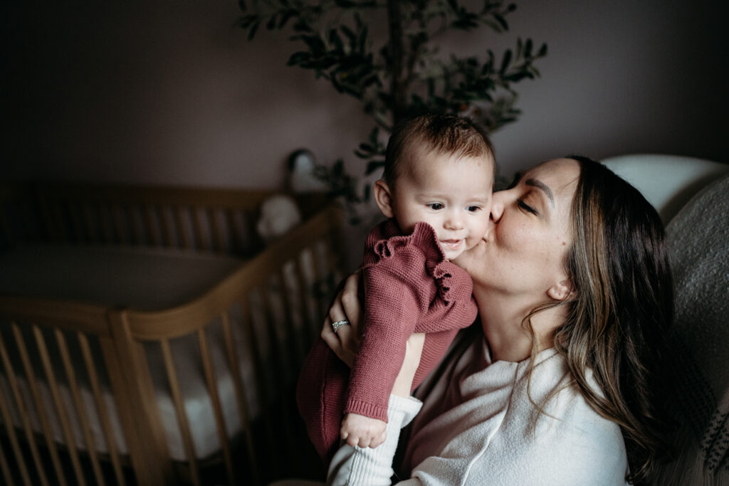 Mom kissing baby Portland Newborn Photographer