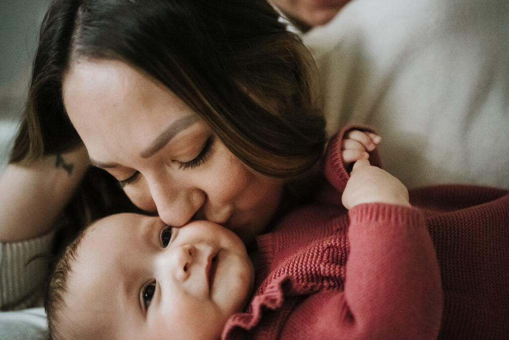 Mom kissing baby Vancouver Newborn Photographer