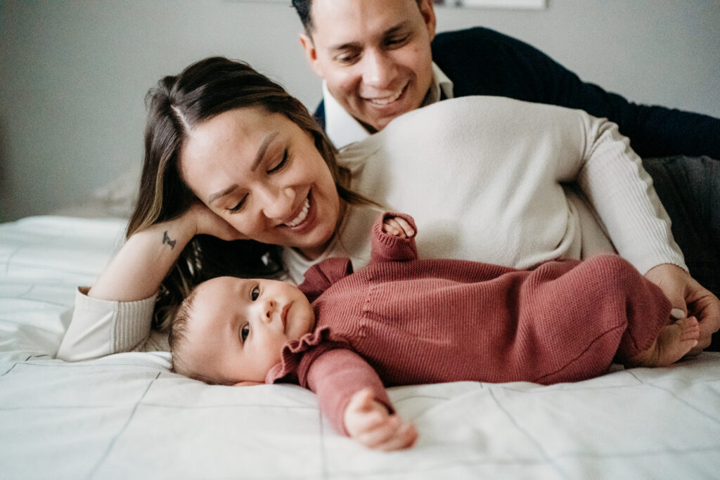 Family on bed in home Vancouver Newborn photographer