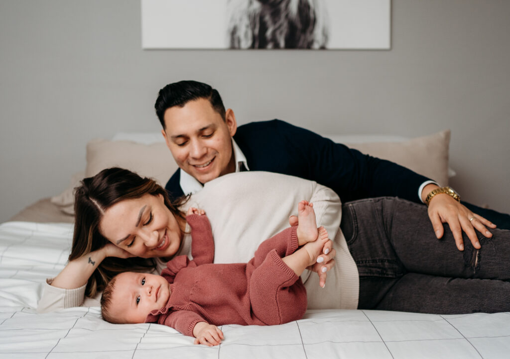 Family on bed in home session Portland Newborn Photographer