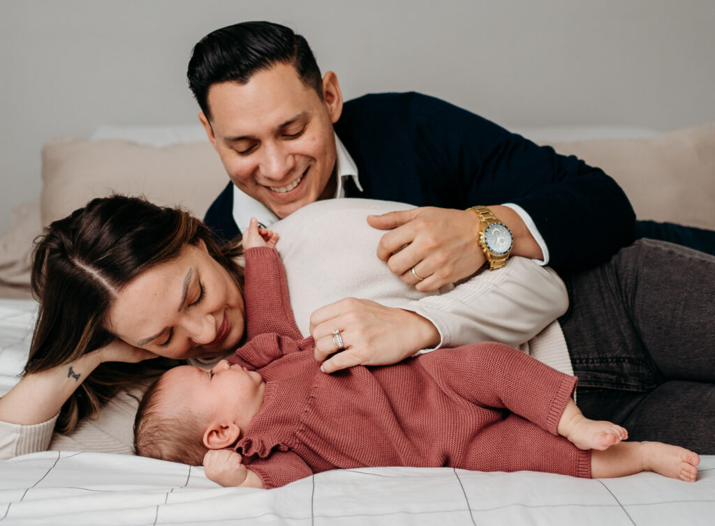 Family together on bed in home Portland Newborn Photographer