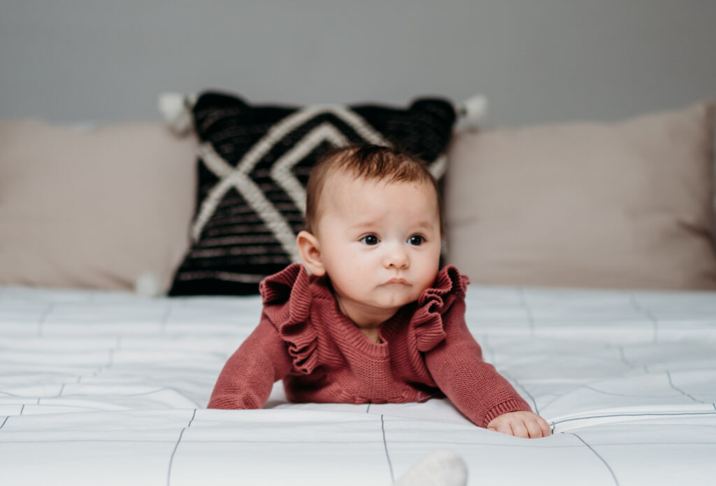 Baby on bed Portland Newborn Photographer
