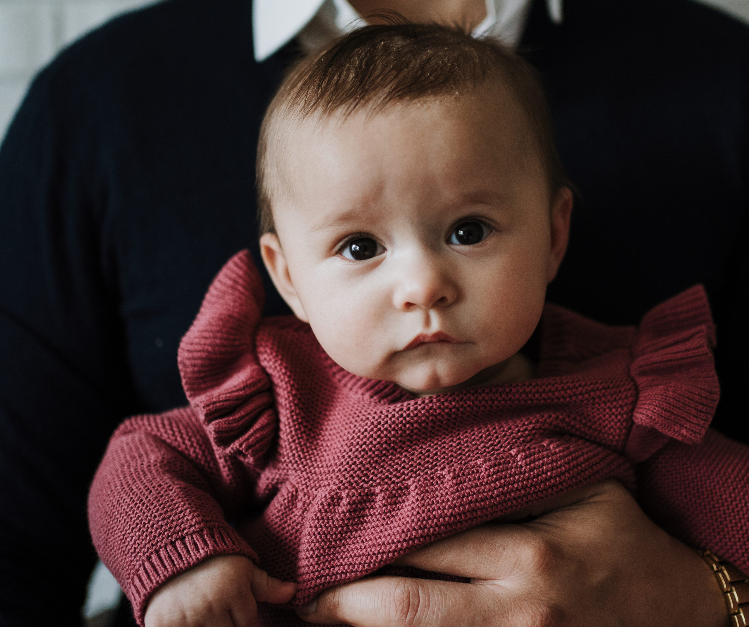 Baby held Lifestyle Newborn Photographer Portland